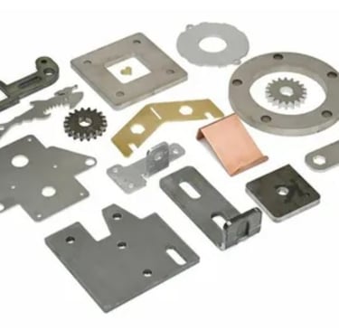 a variety of sheet metal parts including a gear set