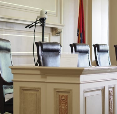Arkansas Historic Supreme Court seats sit empty. This courthouse held trial for theft of services. 