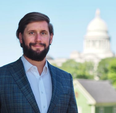 Arkansas Nursing Home Abuse Lawyer Kyle Ludwig poses in front of State Capital Building