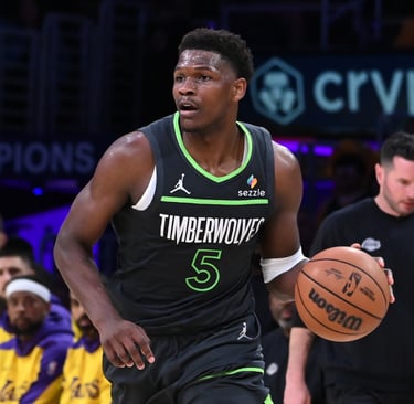 a man in a black jersey and a basketball ball
