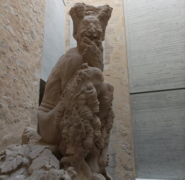 'Le Faune' greets visitors to the Musée Fleury, Lodève, with his wicked grin.