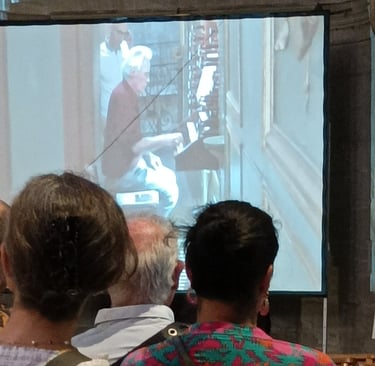 The organist takes his seat