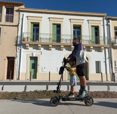 Trotinette users by the side of the canal