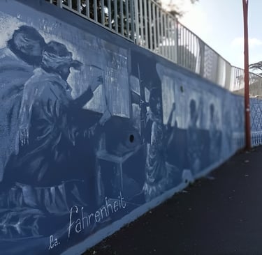 Roadside mural showing the first workers at The Savonnerie.