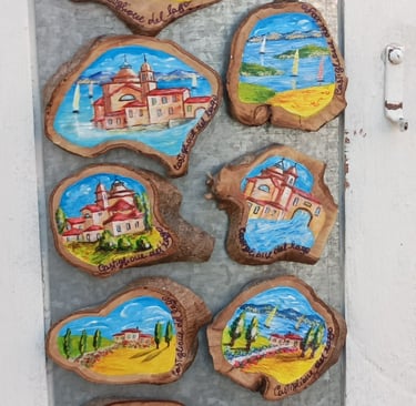 Scenes of Castigliano del Lago painted on wood