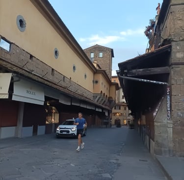 A lone jogger crossed the Ponte Vecchio