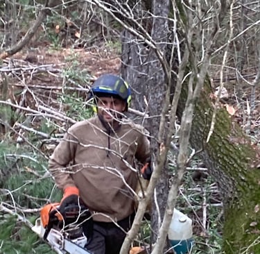 One of the team with his chainsaw