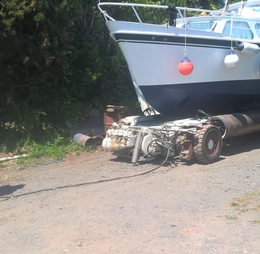 Henri moving our old boat NjivaI before relaunching it.boa