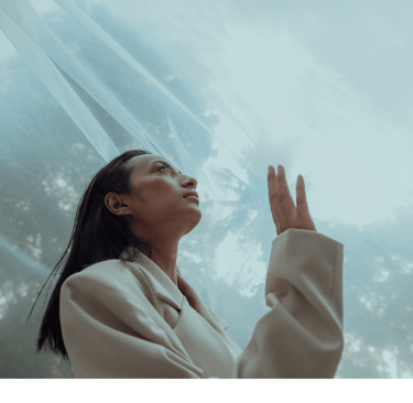 a woman in a white robe is holding her hands up to the sky