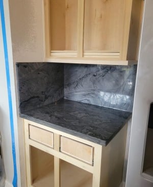 a kitchen counter top with a marble counter top