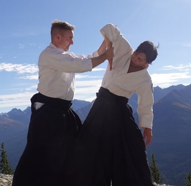 Aikidō students practicing ikkyo wrist control technique during class at Calgary Rakushinkan dojo.