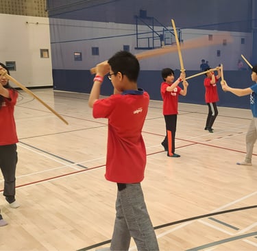 boys and girls practicing kenjutsu together