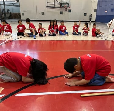kids bowing to each other in calgary aikido class