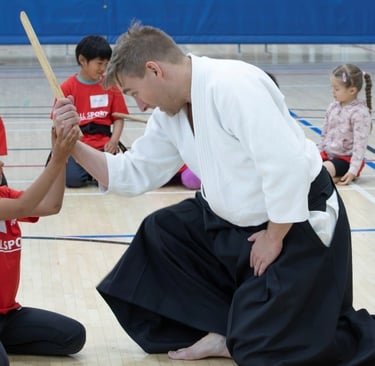 student and instructor practicing kotegaeshi in Calgary aikido class