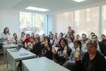 Maybo team celebrating product launch with aloe drinks.