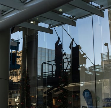 a man in a suit is cleaning glasses