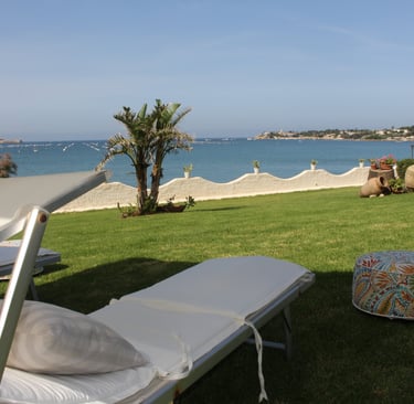 Garden with sun loungers and panoramic sea view of Ortigia, Siracusa, Sicily
