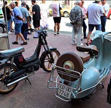 a scooter parked on the side of a street