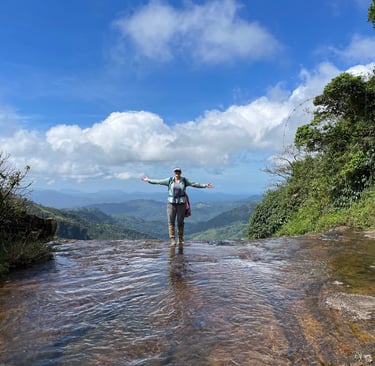 a woman standing in a stream of water