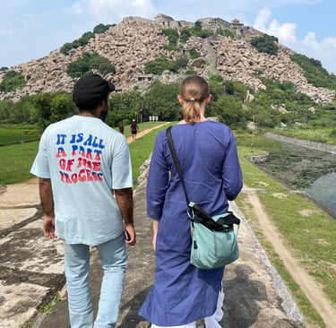 a man and woman walking down a path