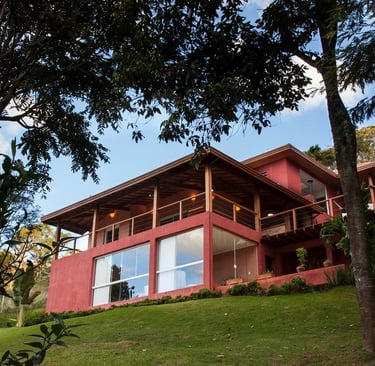 a house with a red exterior and a large window