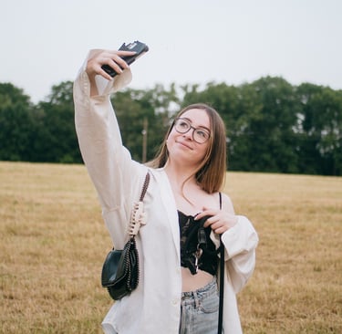 a woman taking a selfie with her cell phone