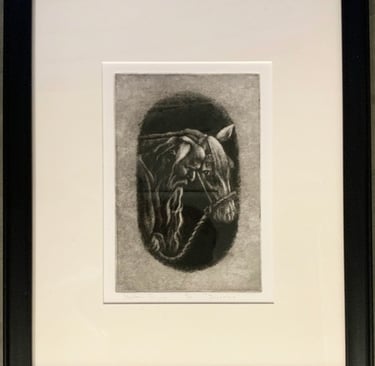 A mesotint of an old man and his horse in a black frame.