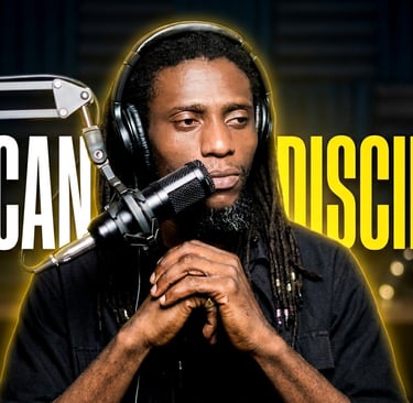 Glody kikonga wearing headphones discussing African discipline behind a studio microphone.