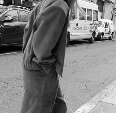 a woman walking down the street in a city
