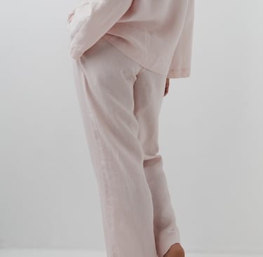 a woman in a pink shirt and pants