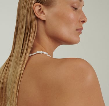 a woman with a white bra in a bikini top