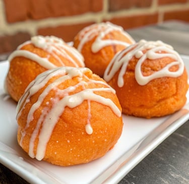 Butter and sugar creamed together with orange zest in a bowl