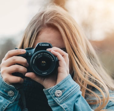a woman taking a picture of herself taking a picture of herself