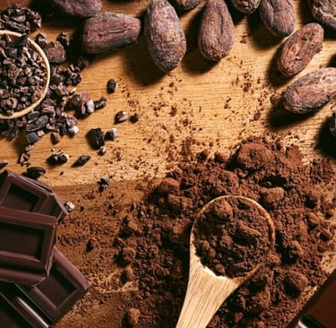 a wooden table with chocolate and cocoa beans