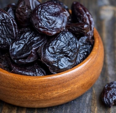 Dried plums in a bowl