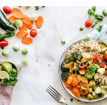 a plate of vegetables and vegetables on a table