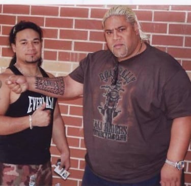 Tongan Tattoo artist Carl Cocker with WWE Hall of Fame wrestler Rikishi 