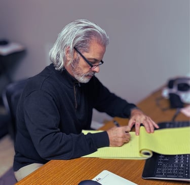 A.J. Marinello sitting at his desk