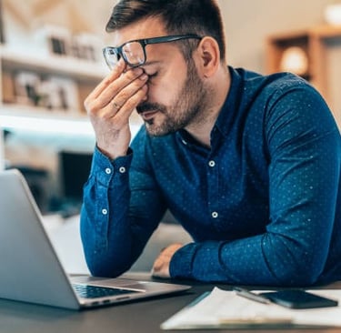 frustrated man with low testosterone at computer