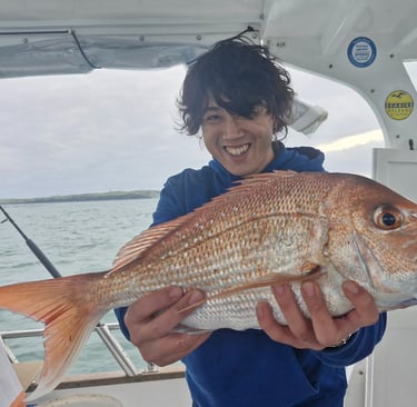 A happy customer with his first snapper