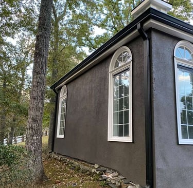 Home with 6K aluminum gutters showing proper pitch and clean installation