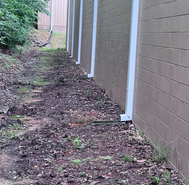 Front view of a house featuring a complete gutter and downspout system