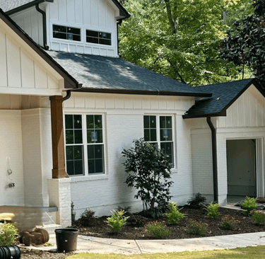 House with gutter guards installed to prevent debris buildup