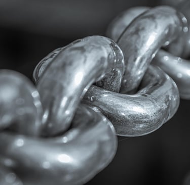 A close-up of a silver chain linked together..