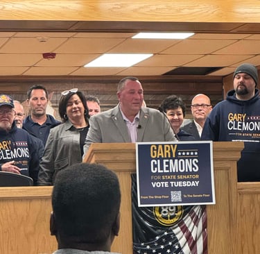 a group of people standing around a podium with signs