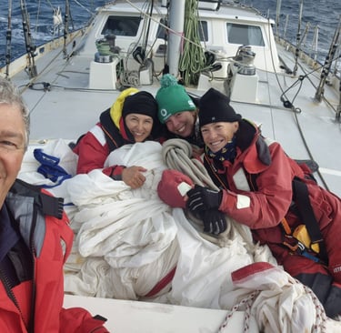 Happy crew working the spinnaker