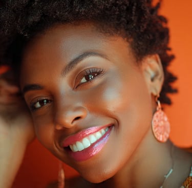beautiful black woman wearing her natural hair. she is smiling at the camera