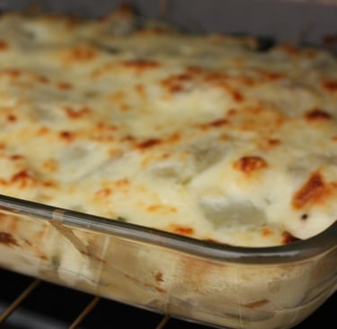 Swiss chard au gratin in a clear baking dish.