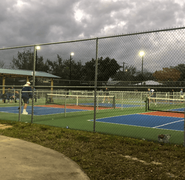 Pickle ball courts with lights in the evening