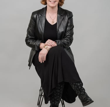 Susanne Blohm on a stool.